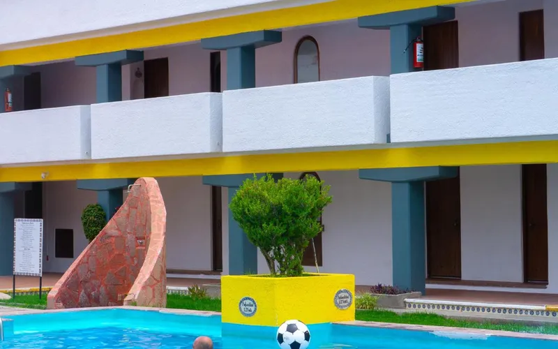 Pool and two-story courtyard wings at Villas Arqueologicas Teotihuacan